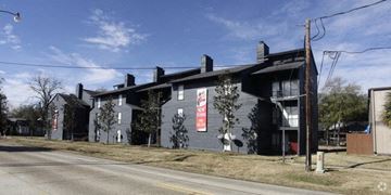 Hammond apartment for rent - a building with a sign on the side of a street