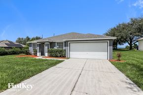 Groveland house for rent - a home with a driveway and a garage door