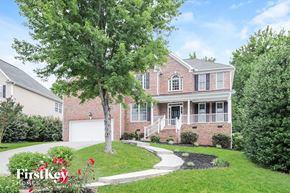 Winston Salem house for rent - a large brick house with a tree in front of it