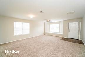 Converse house for rent - A spacious room with a carpeted floor and a ceiling fan.