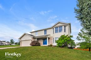 O'fallon house for rent - a house with a blue door on a hill