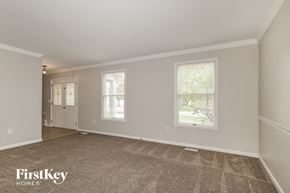 Weldon Springs house for rent - the living room and dining room of an empty house
