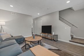 College Park apartment for rent - a living room with a couch and a tv