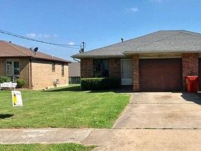 Springfield house for rent - a house with a driveway and a garage door