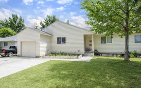 Fairchild Afb apartment for rent - a white house with a driveway and a tree