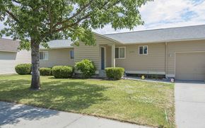 Fairchild Afb apartment for rent - a yellow house with a tree in front of it