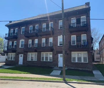 Cleveland apartment for rent - A brick building with white doors and windows.