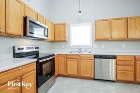 Linwood house for rent - a kitchen with wooden cabinets