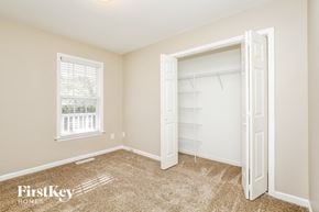 Linwood house for rent - a bedroom with a closet and a window and a white closet door