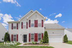 Charlotte house for rent - a white house with red shutters and a blue sky