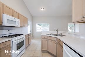 Clermont house for rent - a kitchen with white appliances and wooden cabinets