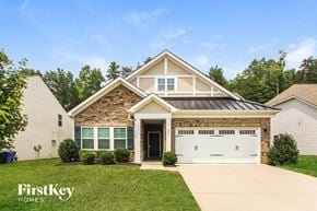 Mooresville house for rent - A house with a garage door that has the number 11 on it.