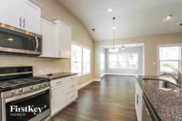 Mooresville house for rent - A kitchen with a FirstKey Homes stove top oven.