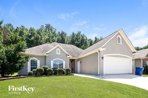 Helena house for rent - A house with a garage and a driveway is shown.