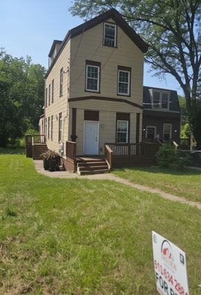 Cincinnati house for rent - A two story house with a sign in front of it.