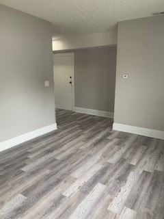 Cleveland apartment for rent - A room with a grey carpet and a white door.