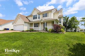 Wentzville house for rent - A large, well-maintained house with a lawn in front.