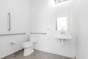 Philadelphia apartment for rent - a bathroom with a toilet and a sink and a mirror