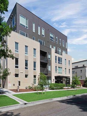Denver apartment for rent - A modern building with a mix of brick and panel facades.