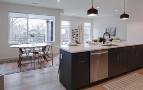 Denver apartment for rent - A kitchen with a dining table and chairs.