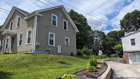 West Warwick apartment for rent - a house on a hill with a street in front of it