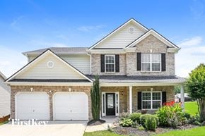 Hiram house for rent - a house with two garage doors in front of it