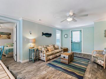 Holmes Beach house for rent - a living room with furniture and a ceiling fan