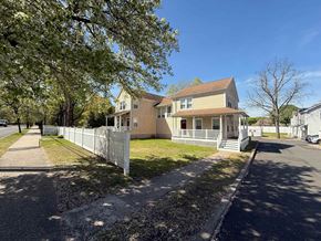New Haven apartment for rent - A house with a white picket fence in front of it.