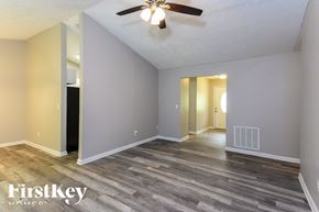 Kennesaw house for rent - A room with a ceiling fan and wooden flooring.