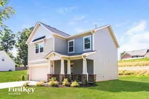 Winston Salem house for rent - A house with a garage and a covered porch is for sale.