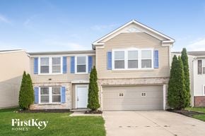 Camby house for rent - A two-story house with a garage is for sale.