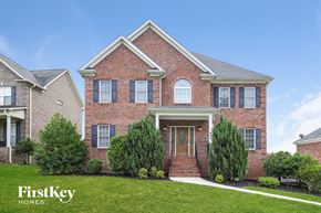 Clemmons house for rent - A brick house with a white door and windows.