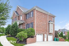 Clemmons house for rent - A brick house with a white garage door.