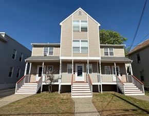 New Haven apartment for rent - A two-story house with a front porch and a covered staircase.
