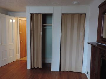 New Glasgow apartment for rent - a living room with white curtains and a door to a closet