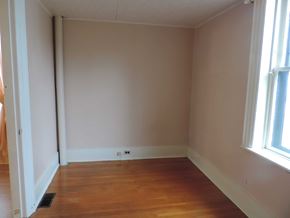 New Glasgow apartment for rent - A room with wooden floors and white walls.