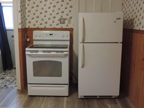 New Glasgow apartment for rent - a white stove and refrigerator in a kitchen