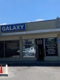 Napa apartment for rent - A store front with a blue sign that says galaxy.