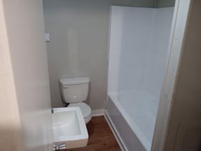 Stantonsburg apartment for rent - A white toilet and sink in a small bathroom.