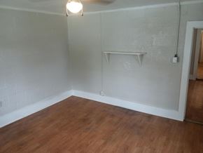 Stantonsburg apartment for rent - Empty room with wooden floor and white walls.