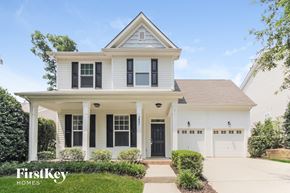 Charlotte house for rent - a white house with black shutters and a porch