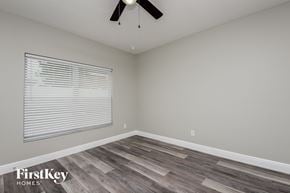Davenport house for rent - the bedroom has a large window and hardwood flooring