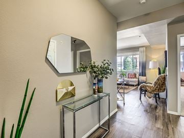 San Diego apartment for rent - a living room with a mirror and a glass table