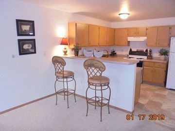 Neenah apartment for rent - a kitchen with two bar stools