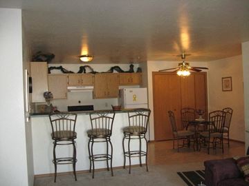 Appleton apartment for rent - a kitchen with a bar and a dining table