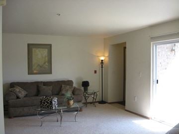 Appleton apartment for rent - a living room with a couch and a table