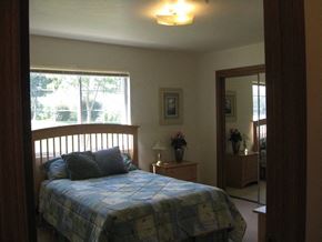 Appleton apartment for rent - a bedroom with a bed and a mirror