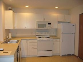 Appleton apartment for rent - a white kitchen with white appliances and white cabinets