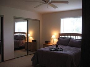 Appleton apartment for rent - a bedroom with a bed and a ceiling fan