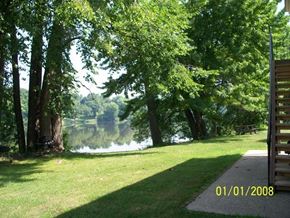 Kaukauna apartment for rent - a view of a lake from a park with trees